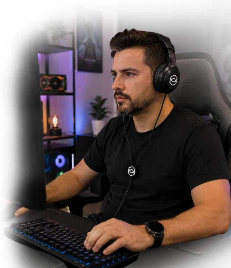 Gamer wearing ZenBud while using a computer